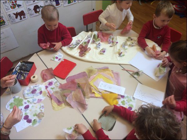 ECO-FRIENDLY: Pupils from Machen Primary School create a collage made from materials solar-dyed in jars