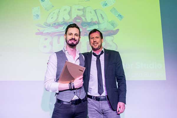 Lewis Williams of Bomper, left, was presented the award by Michael Tomes of Creativepool
