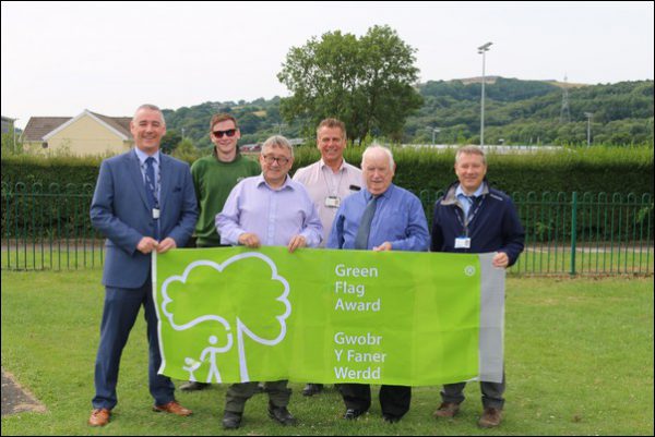 Leader of Caerphilly County Borough Council, David Poole, second from right, at Ystrad Mynach Park, a recipient of the Green Flag Award.