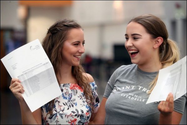 Lauren Davis and Molly Eatwell receive their A Levels at Coleg y Cymoedd