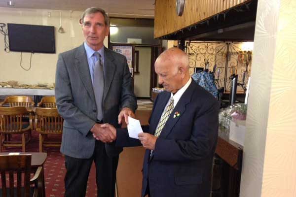 Mr Gardiner, right, was presented with a £50 cheque by his Argoed successor, Cllr Walter Williams