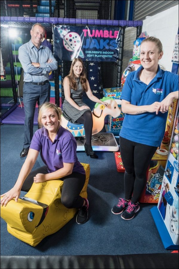 Martin Palmer, left, of UK Steel Enterprise, Claire Vokes from Caerphilly County Borough Council and staff from Tumble Jaks