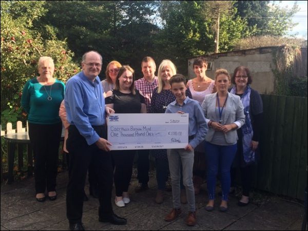 GENEROUS: Cameron Jones, right, presents his cheque to Mind