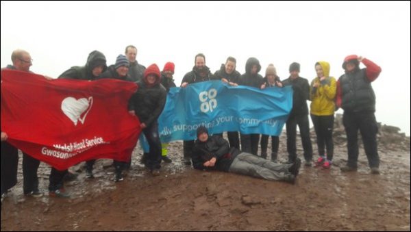 WINDSWEPT: Nelson manager, Chris Witton (centre) and colleagues from Co-op food stores in the area