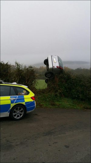 The silver Nissan was discovered almost vertical in a hedge near Machen