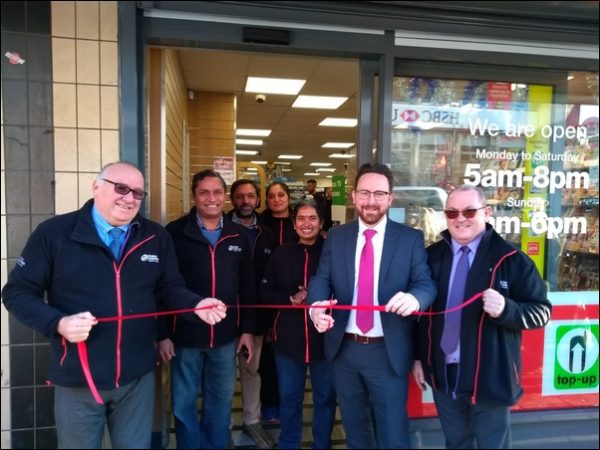 OPEN: The Suri family with representatives from wholesaler Booker and Caerphilly AM Hefin David
