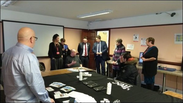 The Welsh Government’s Cabinet Secretary for Regeneration Alun Davies AM speaking to a person an an ITEC course which is held at the Minres' Centre