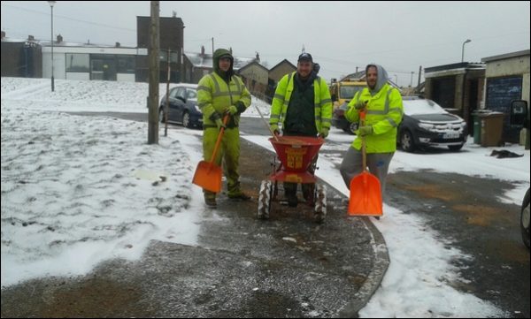 Crews working tirelessly throughout the snowy conditions