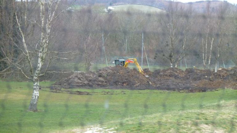Digger moving dumped material at Virginia Park Golf Club