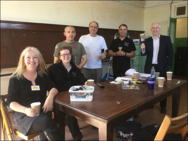 PRAISED: Caerphilly Workmen’s Hall’s volunteers with Wayne David, right