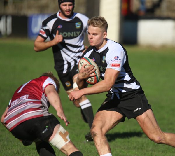 George Gasson takes on a Cross Keys defender