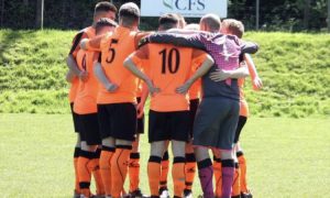 Aber Valley players in a huddle before a match