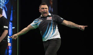 Darts star Gerwyn Price celebrating during a game