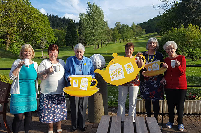 Members of the Caerphilly Fundraising Group celebrating the annual tea party, Picture taken before social distancing