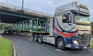 The Trecenydd footbridge being transported back after refurbishment