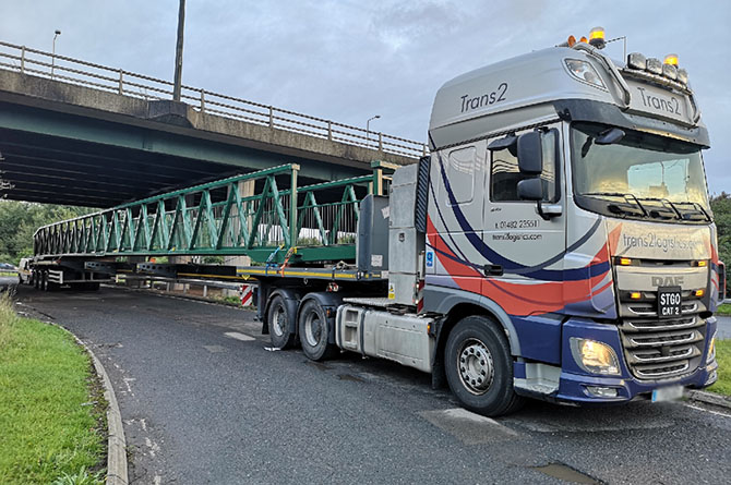 The Trecenydd footbridge being transported back after refurbishment