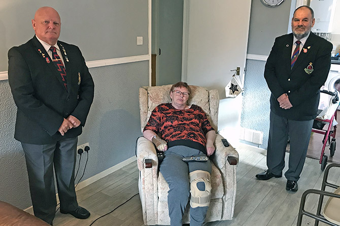Linda Royston with Sir John Lawrence, left, and David Lancaster, of the Royal Welsh Veterans Association