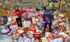 Caerphilly County Borough Council leader Philippa Marsden and Cllr Shayne Cook with gifts donated to Operation Santa