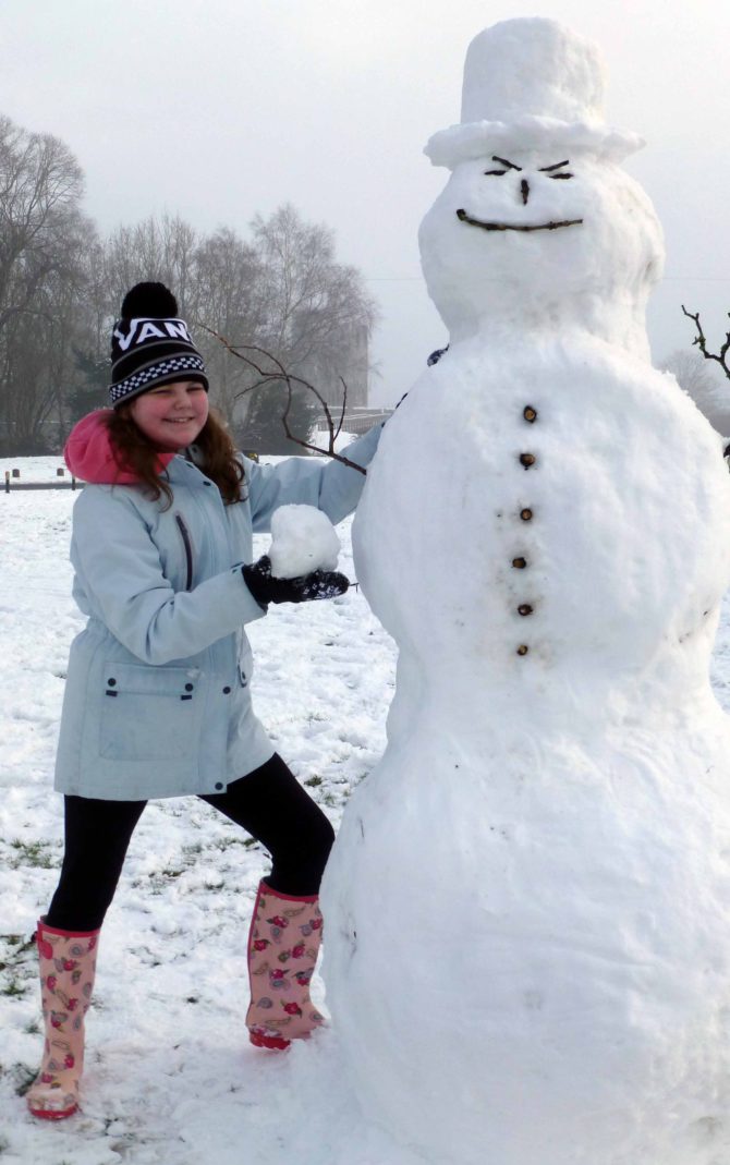 Tianna, 10, with 7ft-tall Frosty the Snowman