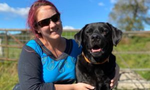 Kirsty James, pictured her with her dog, has Charles Bonnet Syndrome