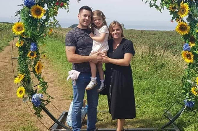Sarah Hall, right, with husband Chris and daughter Jessica