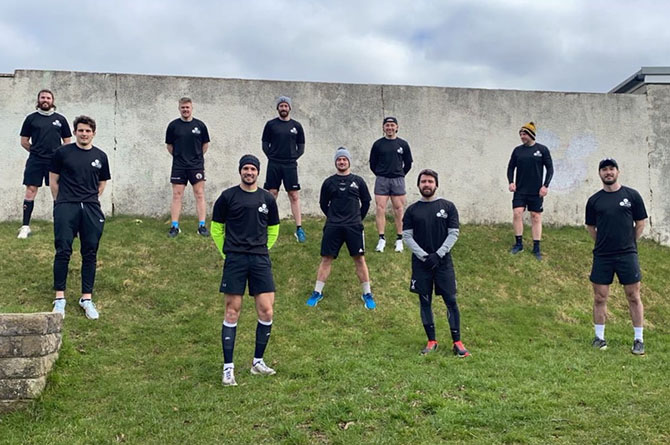 Runners posing for a photo before running 24 miles in 48 hours