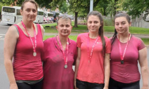 Kirsty Henderson, second left, after a Race for Life event to raise money for Cancer Research UK