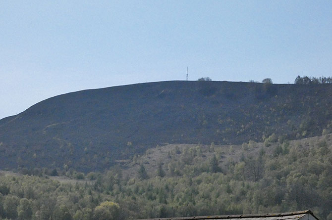 The scorched surface of Machen Mountain, as seen from Crosskeys, in the aftermath of the blaze