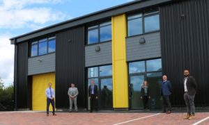 From left: Council officers Allan Dallimore and Mark S Williams; Matthew Savoury of Darnton B3; Jennifer Low of Welsh Government; Cllr Sean Morgan; Vishnu Varsani of Faithful and Gould at the Ty Du site in Nelson