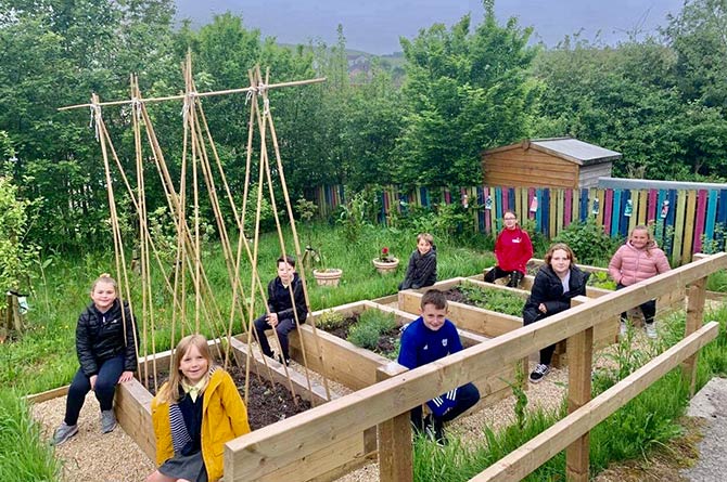 Fochriw Primary School pupils in their school garden