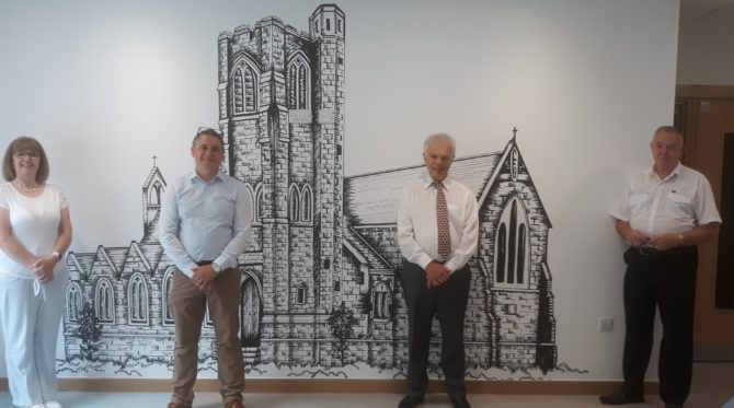Carol Hopkins, chair of Llanbradach Partnership, Rob James of Apollo and Councillors Colin Mann and Rob Gough