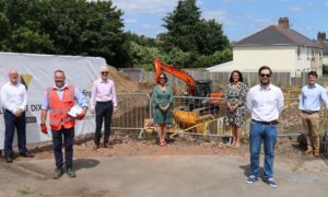 From left: Martin Bennett, Mal Richards and Andrew Dobbs of Willmott Dixon; Cllr Philippa Marsden; Cllr Lisa Phipps; William Jones of Willmott Dixon; Chris Boardman of Caerphilly County Borough Council outside the new development in Trecenydd
