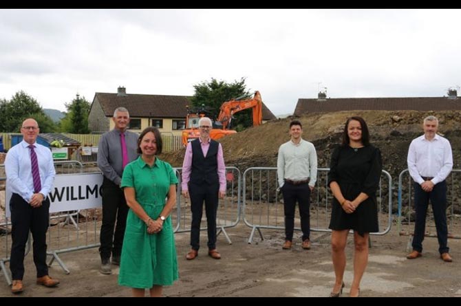 Council leader Philippa Marsden and cabinet member Lisa Phipps, both front, at the site of the new flat development in Trethomas