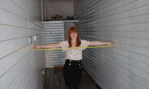 Debra Bisley, of Paul Fosh Auctions, measures the store