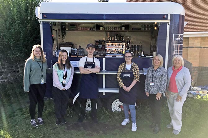 Caffi Caredig staff and volunteers outside the mobile coffee shop