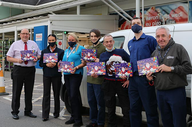 Staff at Tesco Ystrad Mynach with selection boxes donated to the Operation Santa appeal