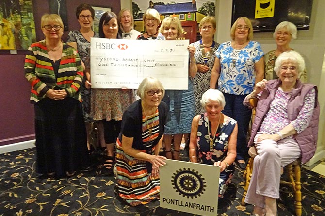 Inner Wheel members present a cheque worth £1,000 to Emma Wilkins, the fundraising manager for breast services at Aneurin Bevan University Health Board