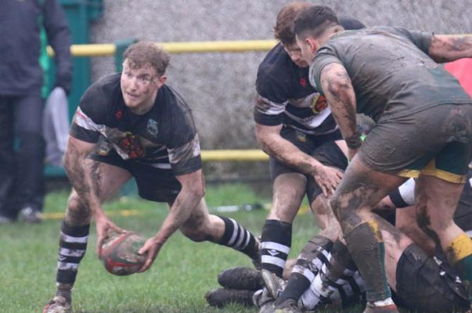 Bedwas scrum-half Rory Harries offloads the ball against Beddau