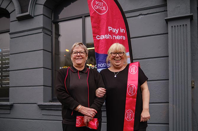 Post Office workers Chris Motruk, left, and Lisa Racz