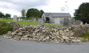 The drystone wall at St Tudor's Church is regularly damaged by HGVs