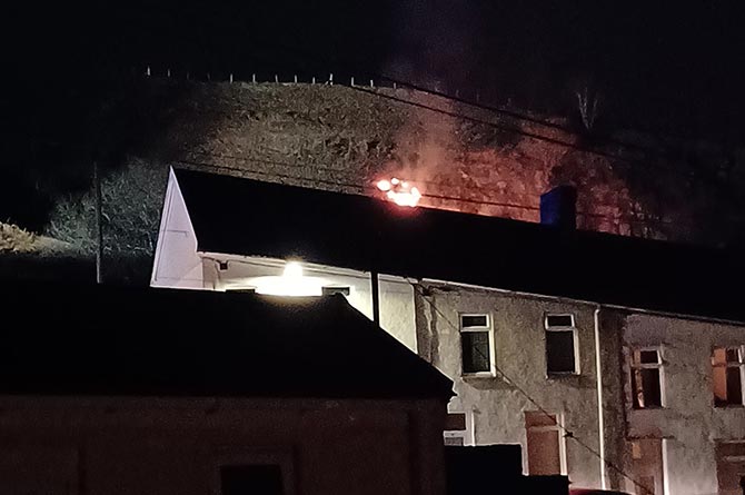 A grass fire broke out near houses in Senghenydd on Wednesday evening