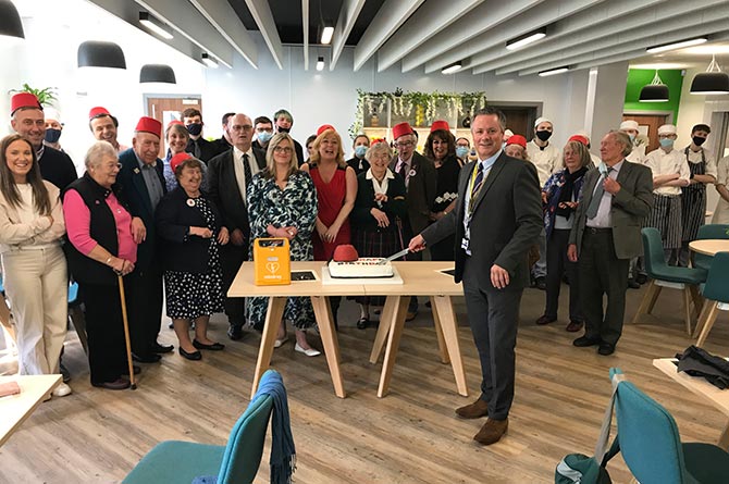 Stuart Davies cuts the cake at the annual Tommy Cooper birthday lunch