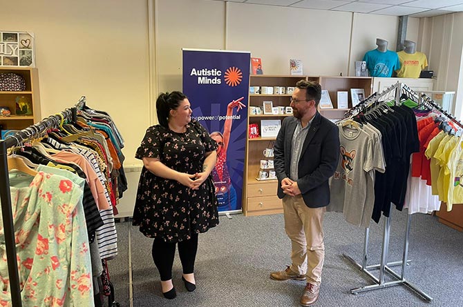 Caerphilly MS Hefin David at the launch of Autistic Minds' new charity shop