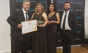 From left: Student Martin Adams; catering technician Sarah Deacon; Deputy Head of the Catering Hailey Hunt; student Joshua Hutton collect their certificate at the 2022 Food Awards Wales
