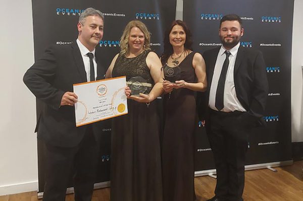From left: Student Martin Adams; catering technician Sarah Deacon; Deputy Head of the Catering Hailey Hunt; student Joshua Hutton collect their certificate at the 2022 Food Awards Wales