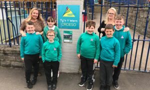 Pupils from the Acorns class at Ty'n y Wern with their teacher Caroline ap Hywel, left and headteacher Sophie Goodliffe