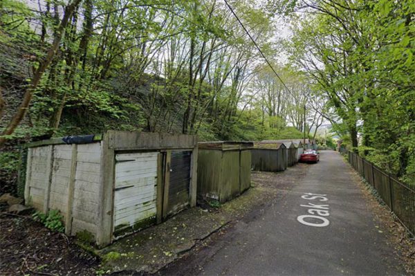 Eight garages on Oak Street will be knocked down and replaced