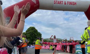 Dewi Griffiths crosses the line to win the 2022 Caerphilly 10k