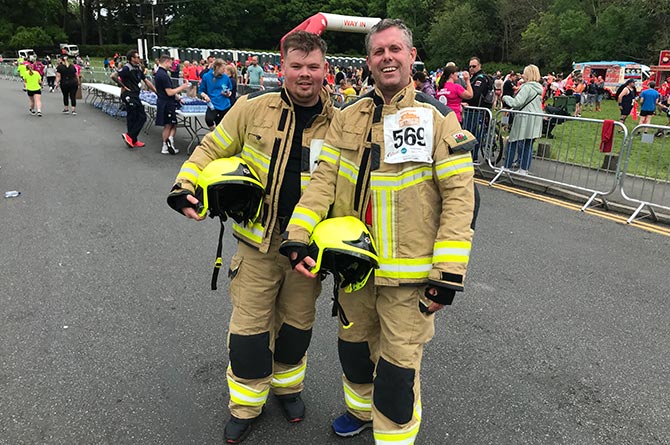 Firefighters Tony Howarth and Lee Prescott ran the Caerphilly 10k in uniform