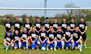 Cwrt Rawlin FC players wearing t-shirts sporting the words 'Football welcomes refugees'